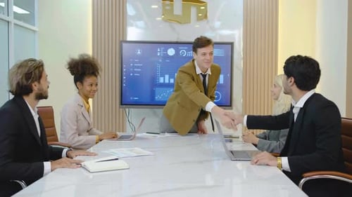 Business Team Presentation at Modern Conference Table