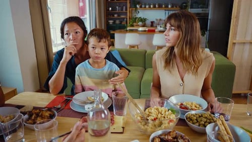 Family and Friends Share Meal at Home