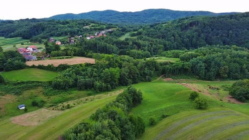 Valley with Fields Meadows Agricultural Farms Forests and Houses
