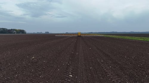 Tractor Spraying On Field With Sprayer, Herbicides And Pesticides