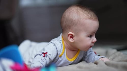 Adorable Infant Lying on Stomach at Home