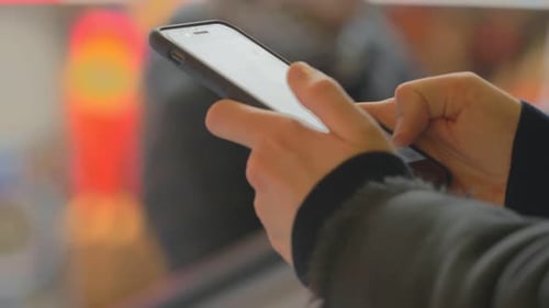 connection, communication - woman hands type on the phone to send a message