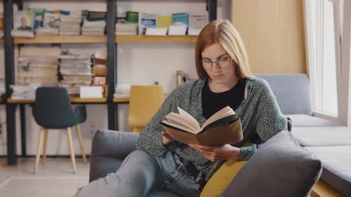 Full Body Young Smiling Happy Smart College Student Girl Wear Green Casual Clothes Sit in Chair