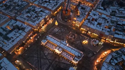 Night aerial shot of Krakow Main Square in winter, Poland