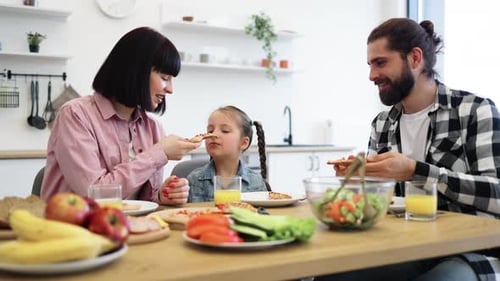 Loving Family Sharing Meal Together in Bright Kitchen