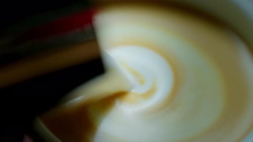 Barista Make Coffee Latte Art with Coffee Espresso Machine in Coffee Shop