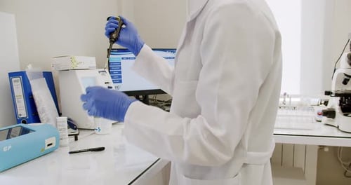 Scientist Conducting Scientific Experiment in Lab
