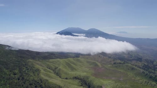 Aerial view of beautiful sky in misty mountains nature in the distance covered in clouds