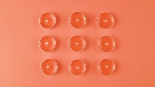 Aroma Candles with Glitter Sprinkles on Pink Background Close Up Top View Summer Bright Texture