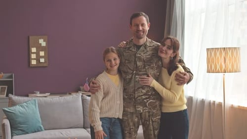 Happy Family Portrait with Military Man in Uniform