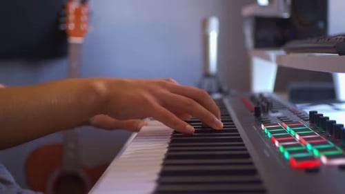 Hands Play Digital Keyboard in Home Studio
