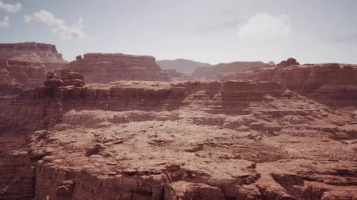 Aerial Flyover Over Vast Arid Desert Canyon Landscape