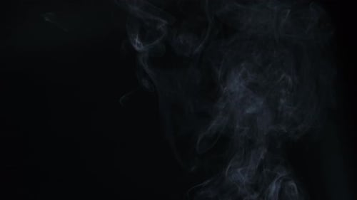 Pale Smoke Rising on Black Background