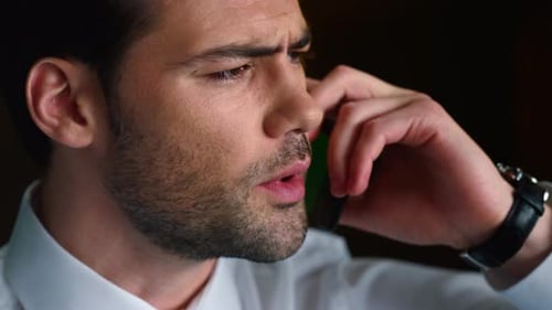 Portrait Of Serious Businessman Face Talking On Smartphone In Office. Male Professional Calling O...