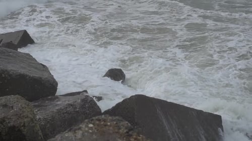 Waves crashing rocks on the west coast of Denmark