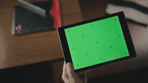 Female Hand Holding Tablet Computer. Woman Touching Finger Green Screen Tablet Pc