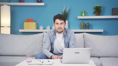 Man looking negative at camera.