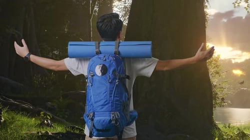 Back View Of A Male Spreading Arms And Looking The View Around While Exploring Nature