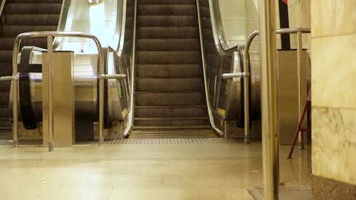 Empty Escalator Operating in a Subway Station