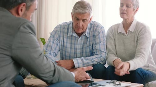 Mature Couple Discussing Financial Plan with Advisor