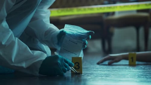 Forensic Investigator Collects Crime Scene Evidence
