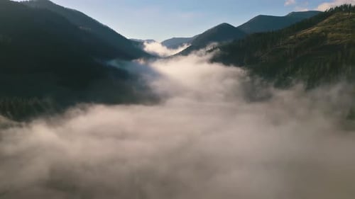 Aerial View of Foggy Clouds in Alpine Mountains
