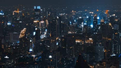 Nighttime city skyline view showcasing bright lights and skyscrapers