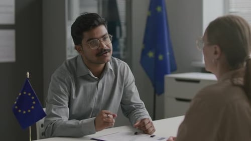 Indian Visa Applicant Speaking with Female Consular Officer at EU Embassy