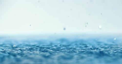 Rain Water Droplets Hitting Water Surface Rippling