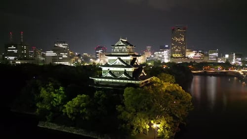 Aerial video of the Hiroshima skyline with Hiroshima Castle in Japan