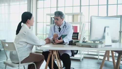 Doctor and Patient Discussing Health in Bright Office