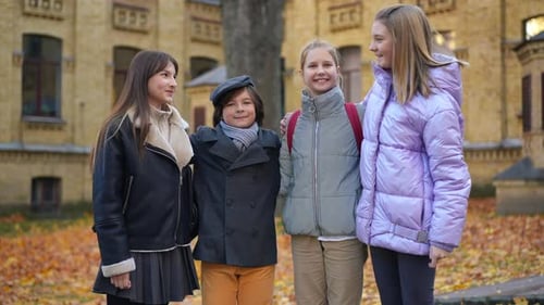 Happy Students Give Thumbs Up in Autumn