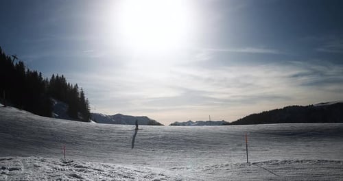Young Woman Skiing in Alps Mountains on Sunny Day - Skier Riding