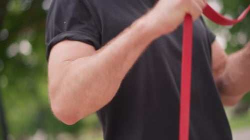 Man Exercising With Resistance Band Outdoor Workout
