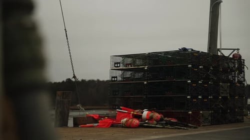 Telephoto shot of fishing pier with maine lobster traps and bouys, 4K video