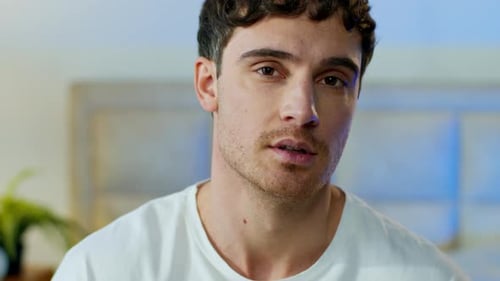 Smiling Man in White Shirt Indoors Close Up