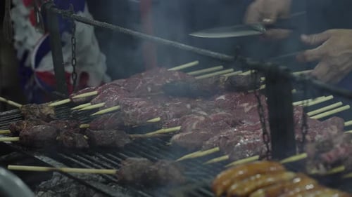 Traditional South American Barbecue Grill with Skewers and Sausages Chile