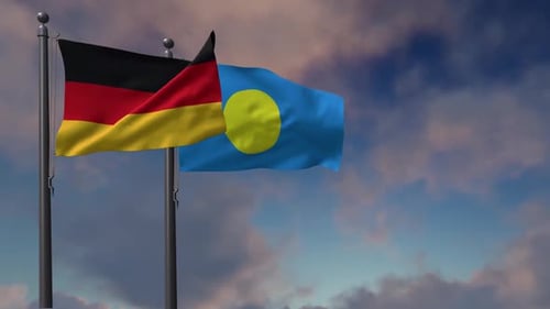 Waving Flags of Germany and Palau Against Sky