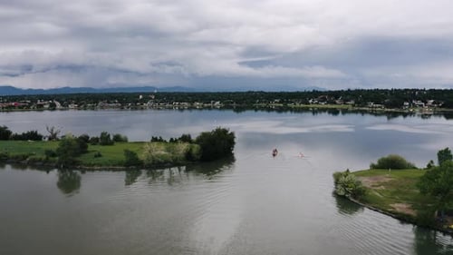Aerial view of people paddling through Sloan Lake in Denver, Colorado.