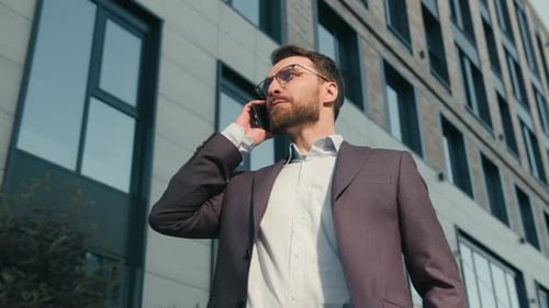 Caucasian Angry Male Entrepreneur Man Answer Call Talk Phone Arguing in City Near Office Stressed