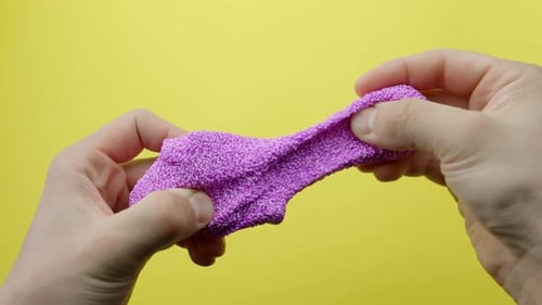 Kneading Pink Floam Slime for ASMR with Bright Yellow Background