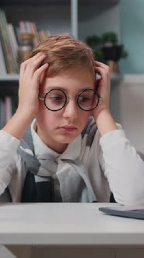 Tired Exhausted Kid Boy Leaning His Head with Eyeglasses He is Preparing for Exams and Looking