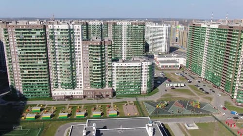 Modern Residential District with Green Buildings and Playgrounds