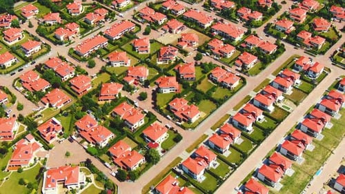 Aerial drone footage over the summer street. Modern luxury houses. Aerial flying over the residentia