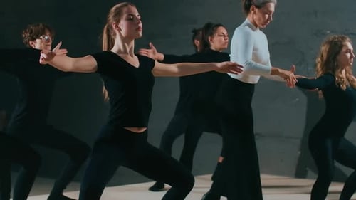 Dance Class Performing Choreographed Routine in Studio