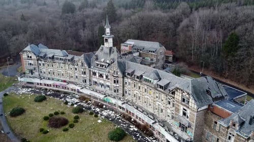 Sideways drone shot of abandoned hospital in Belgium.
