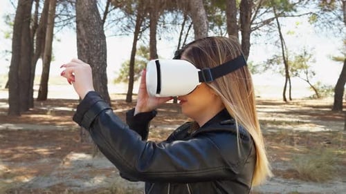 Woman Experiencing Virtual Reality in a Park