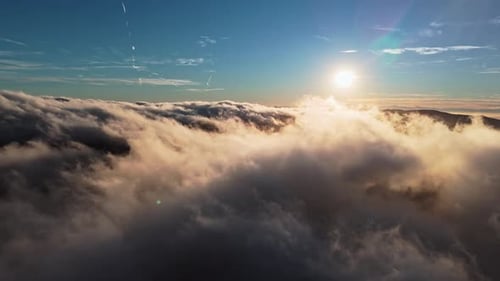 Aerial View of Golden Clouds at Sunrise