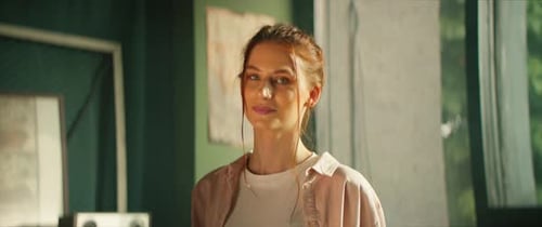 Smiling Redhead Woman in Art Studio