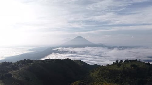 Volcano Peaks Emerging Above Low Clouds Misty Mountain Range Sunrise